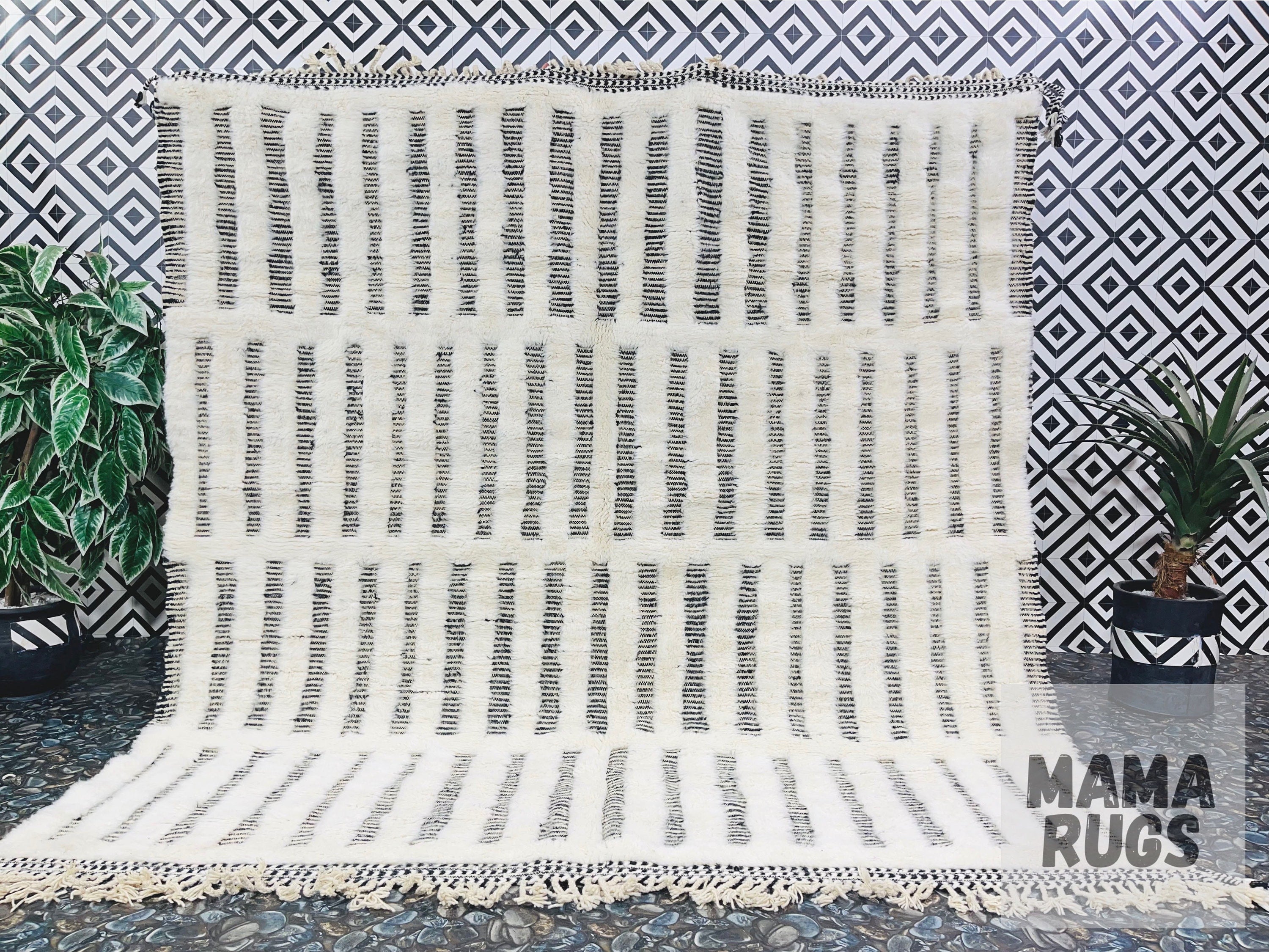 handwoven rug with black and white stripes