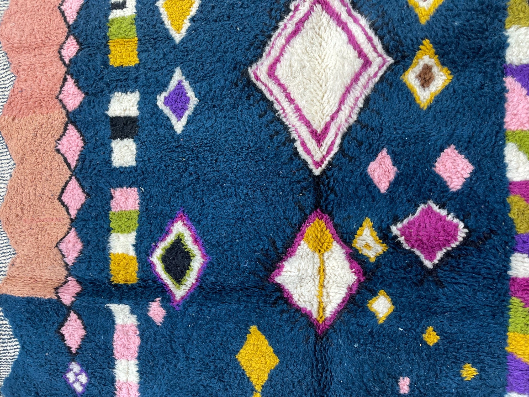 colorful geometric patterned textile close up