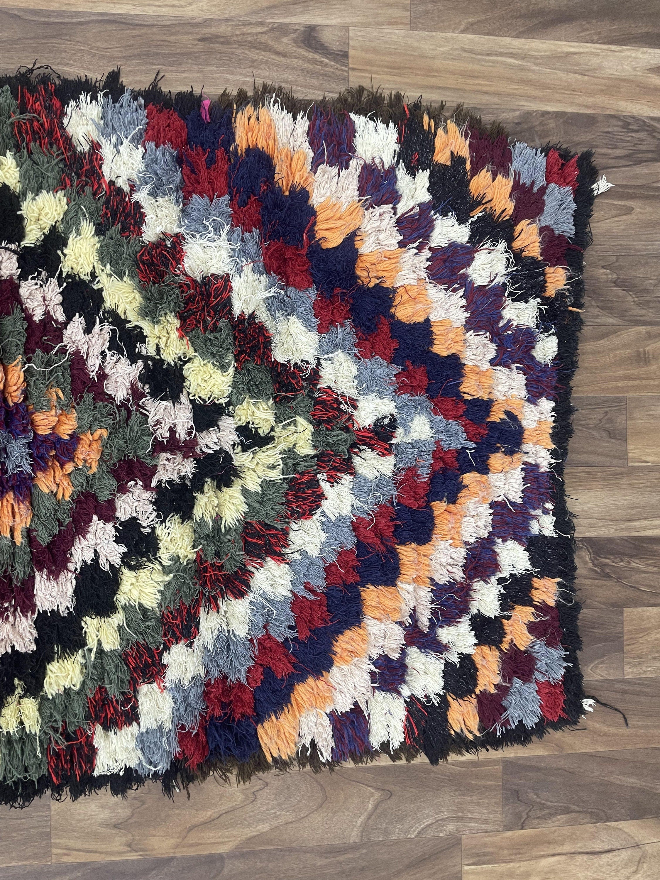 Colorful shaggy area rug with a textured pattern, designed to enhance any living space.