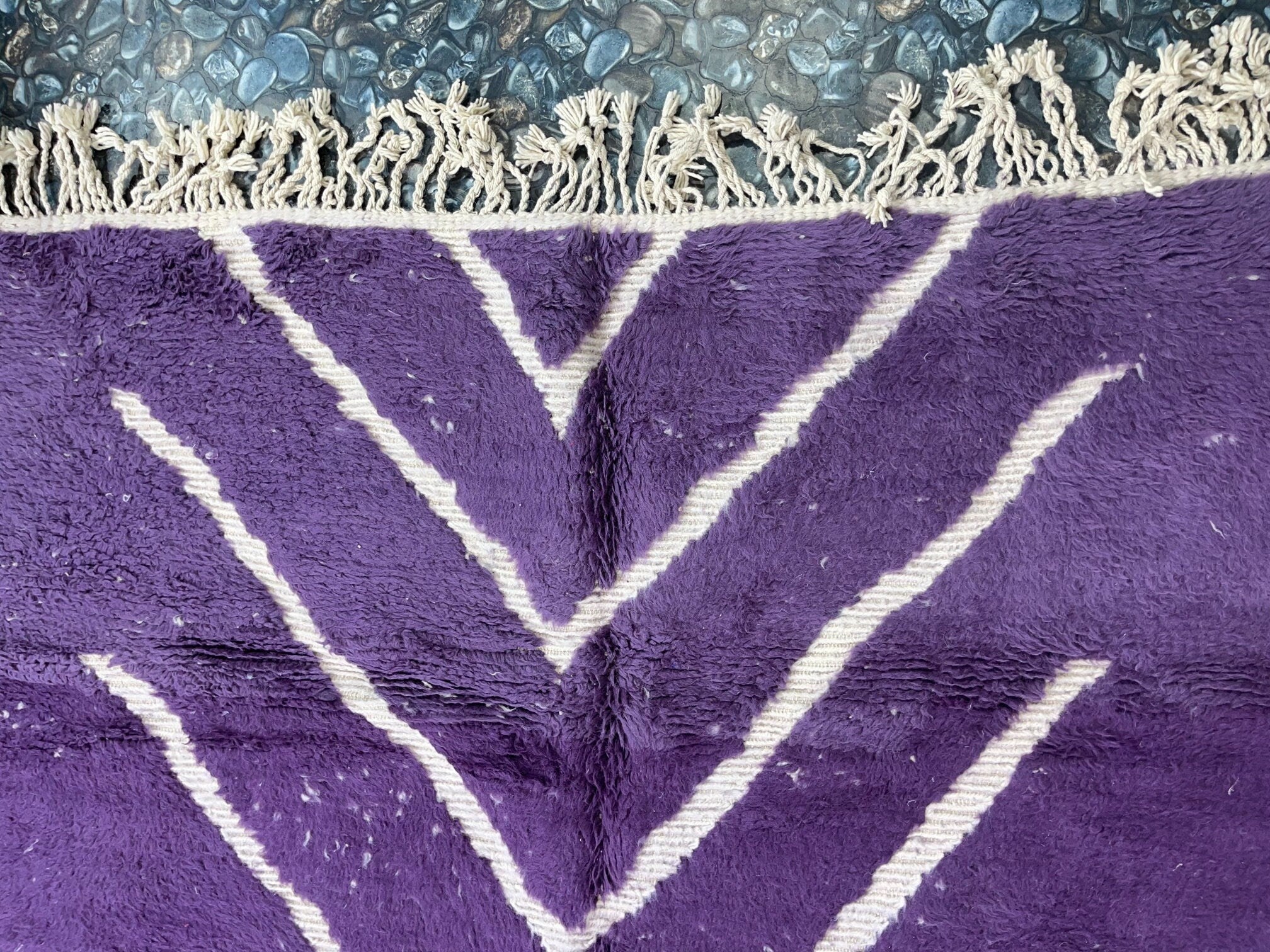 purple patterned rug with white stripes design