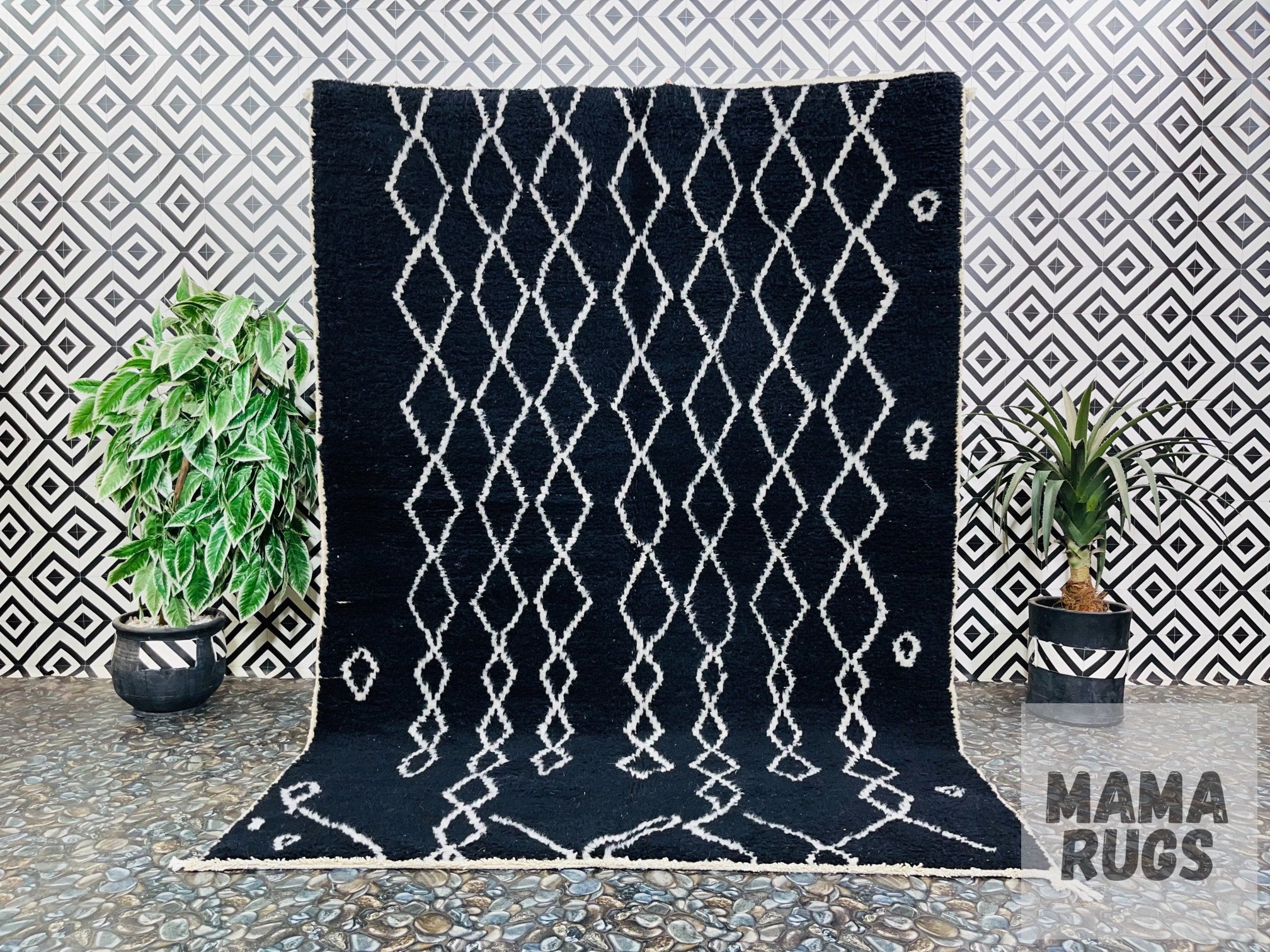 Hand-knotted black and white wool rug with geometric patterns