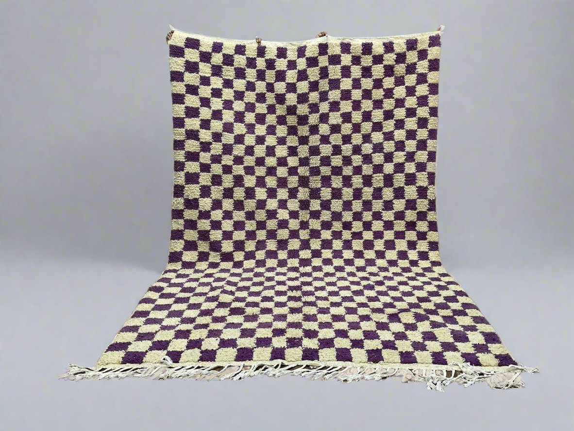 Purple and beige checkered rug with fringe, enhancing any home decor style.