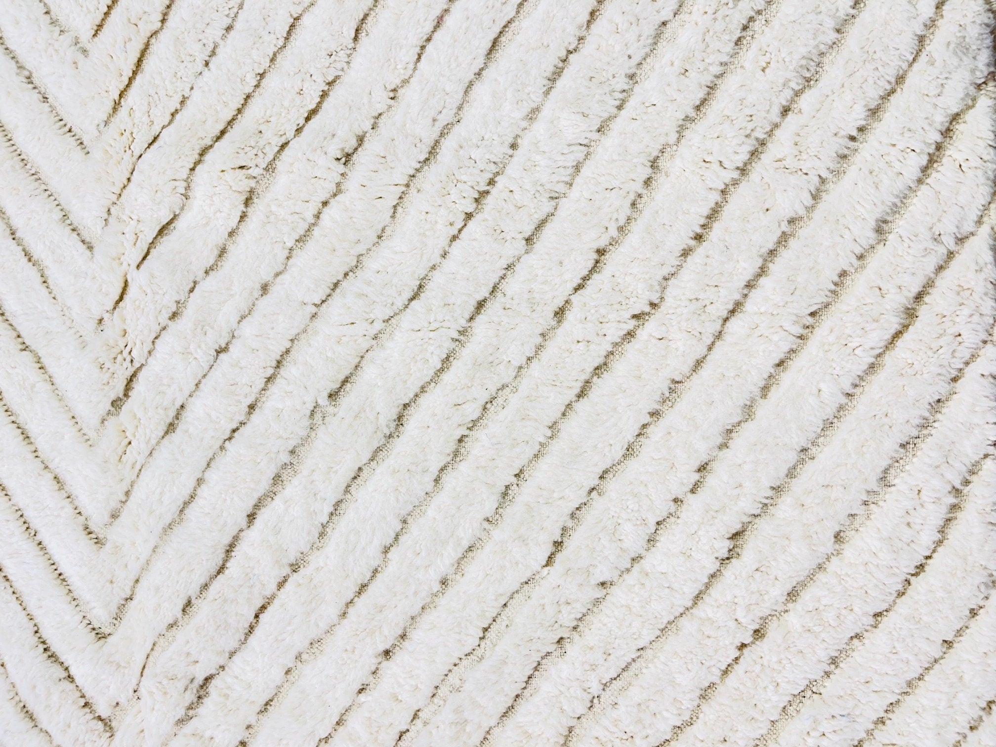 textured cream fabric with chevron pattern design