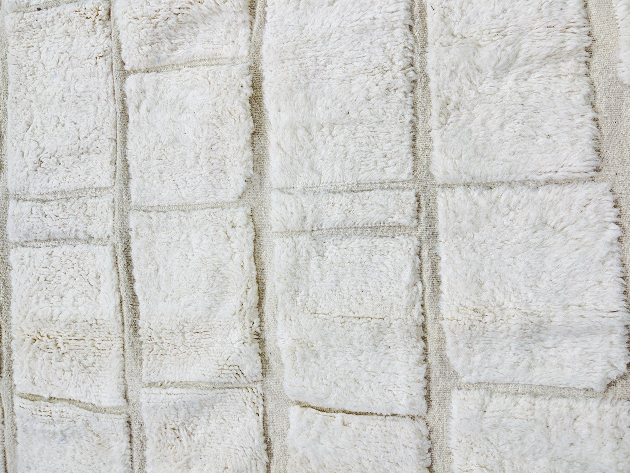 white textured fabric with soft fluffy squares