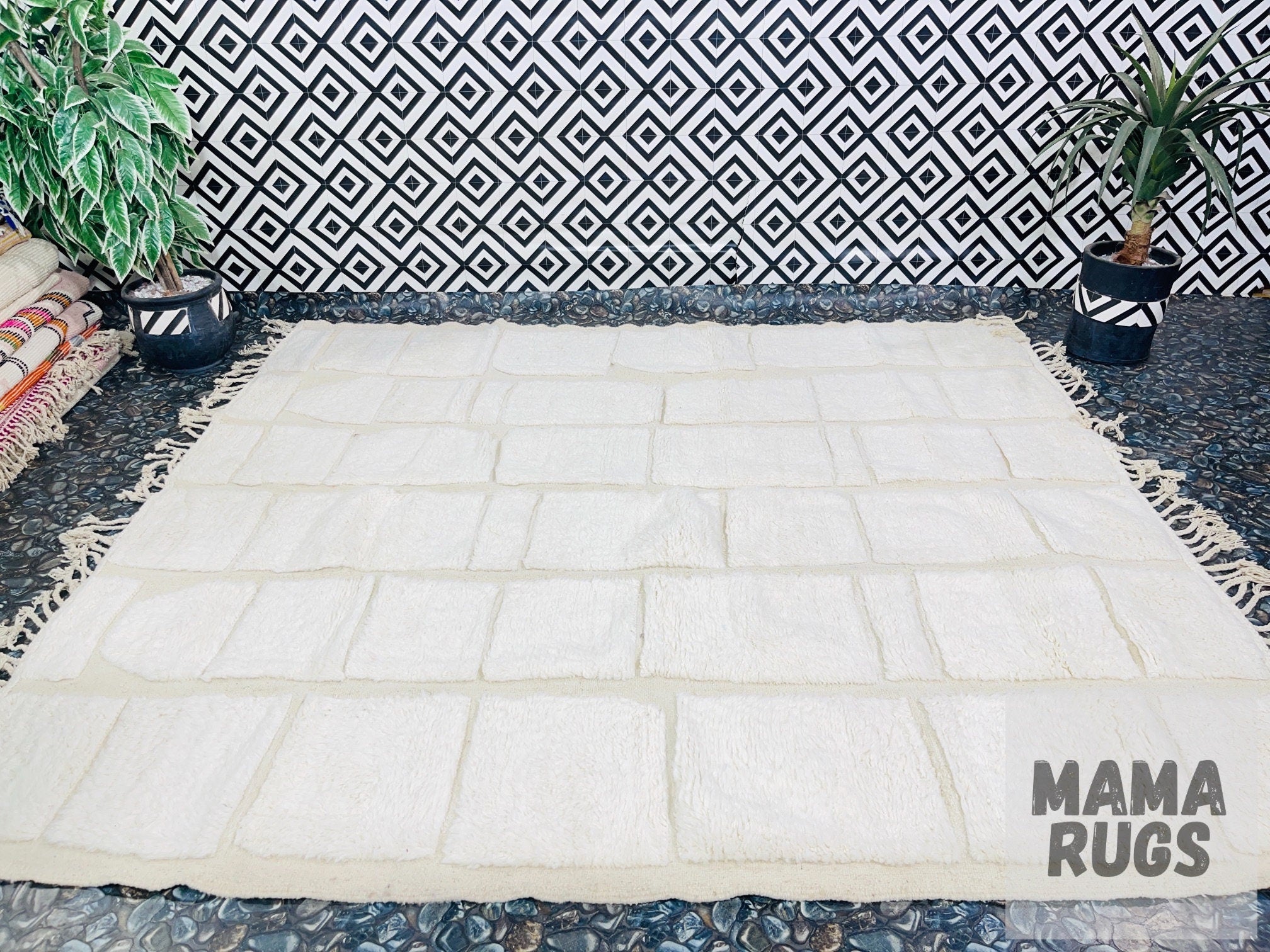 white textured area rug on patterned floor