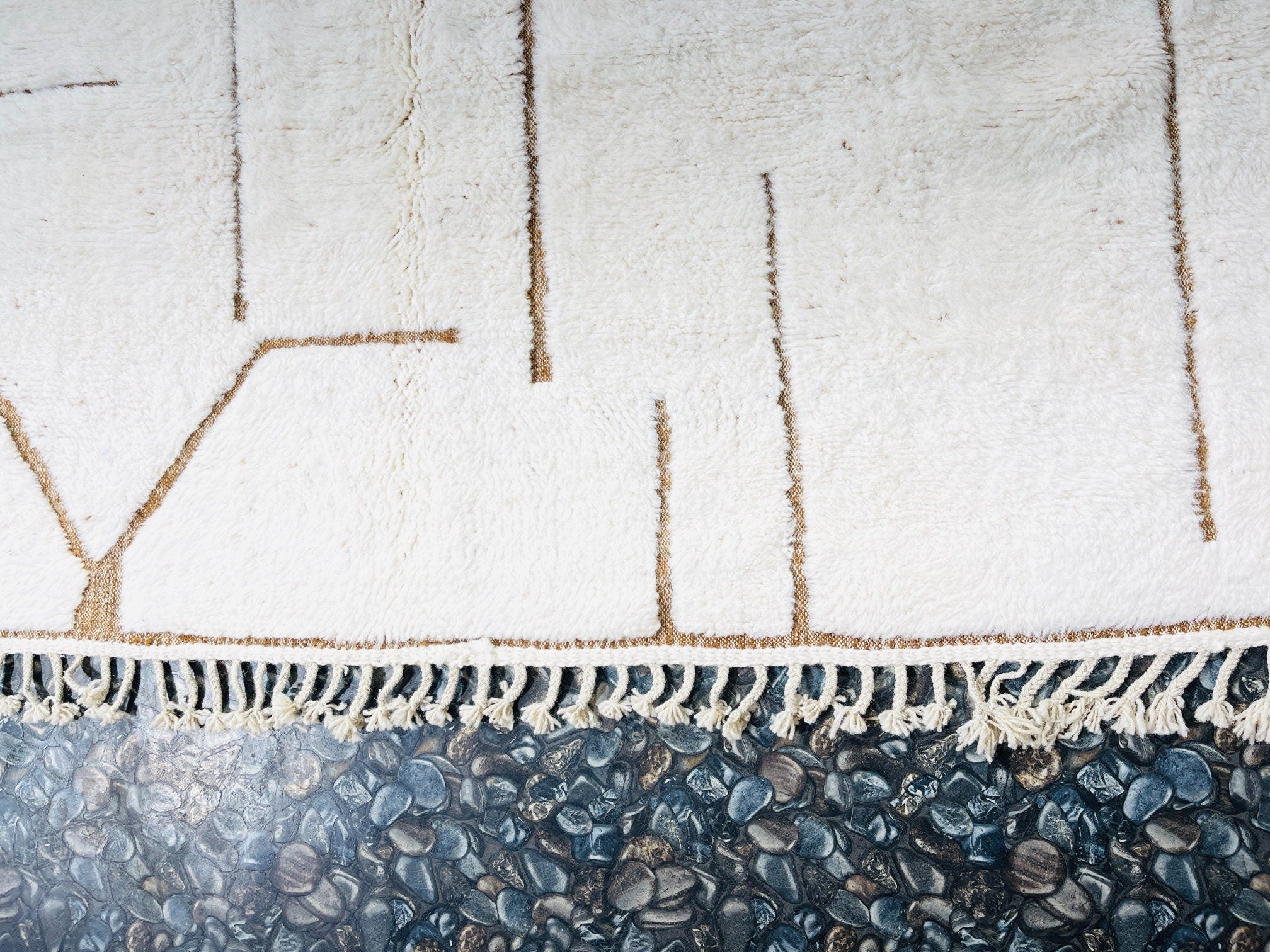 textured white rug with decorative fringe detail