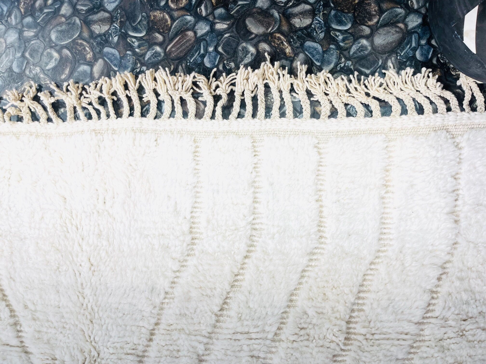 soft white towel on textured stone surface