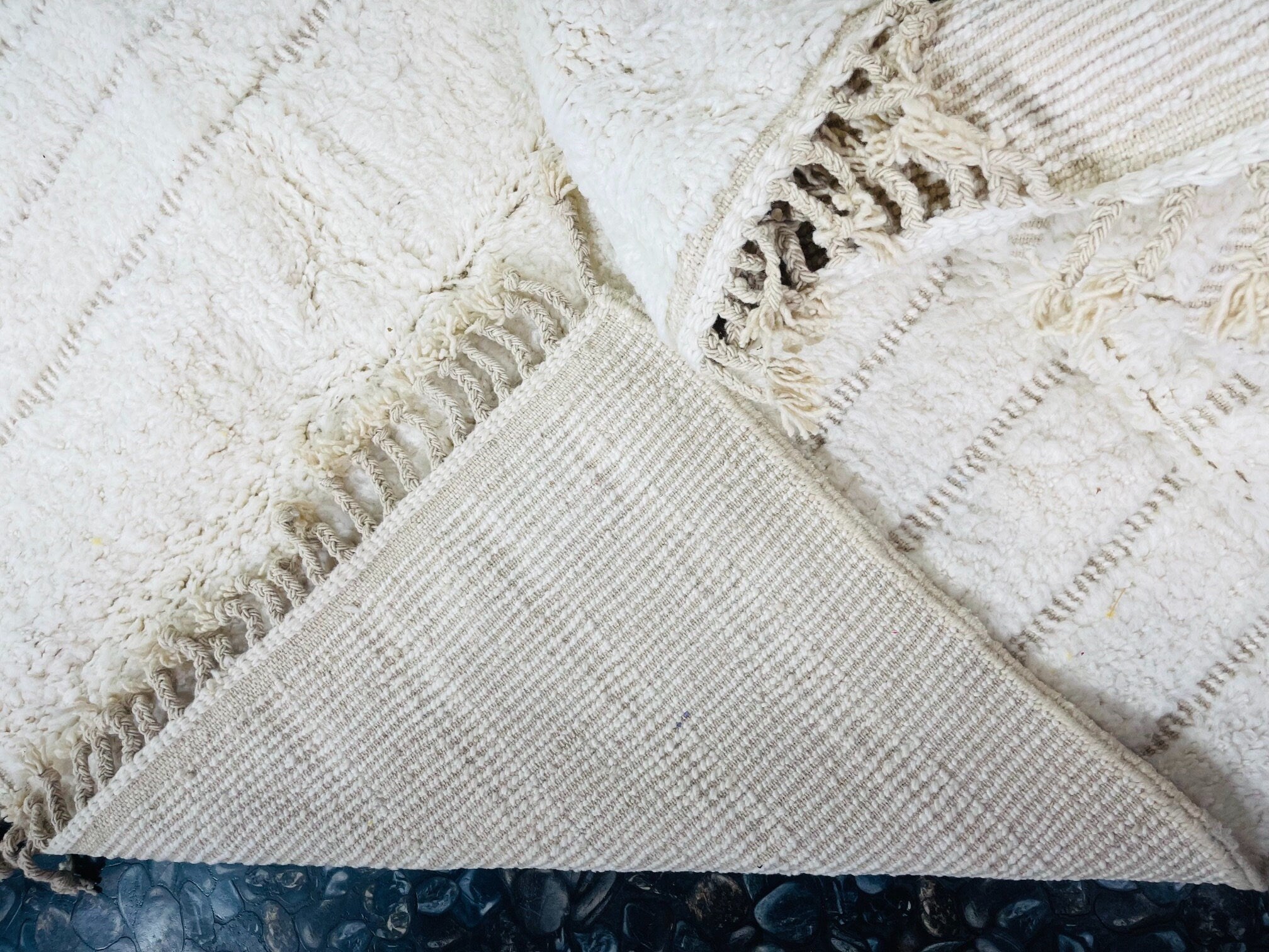 white textured rug with fringe detail closeup